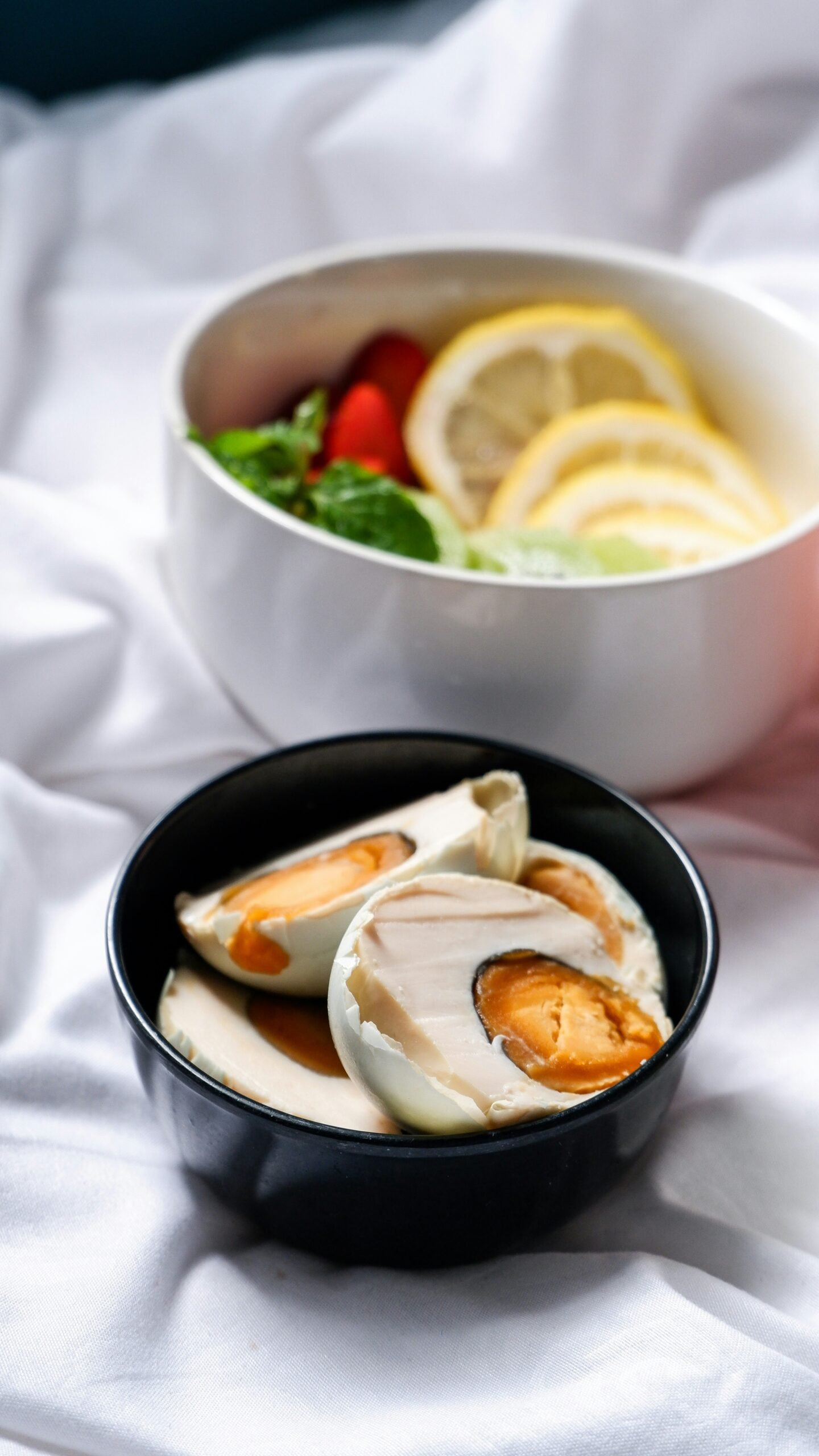 a bowl of soup and a bowl of dumplings